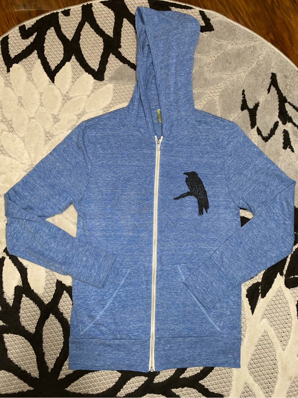 Woman’s Blue Zip-Up Hoodie with Raven Graphic Size XS
